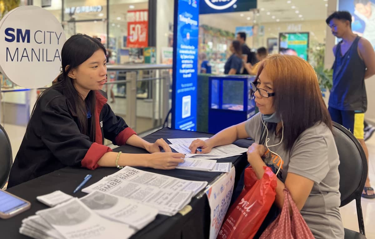 A business owner affected by the recent calamity seeks vital support at the Calamity Recovery Care Center in SM City Manila.